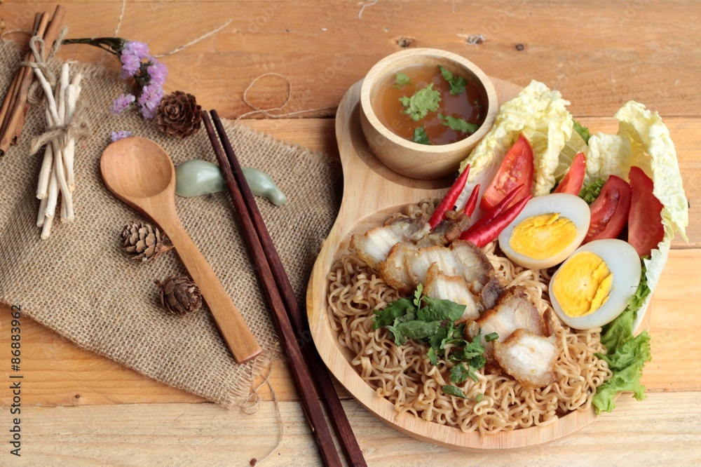 Instant noodles soup put crispy pork and egg Instant noodles soup put crispy pork and egg