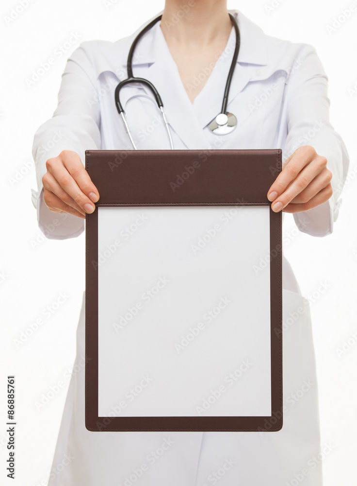 Unrecognizable doctor holding empty clipboard