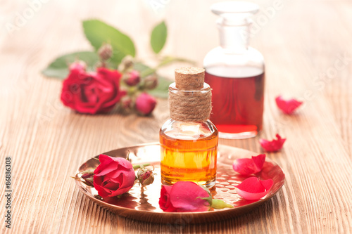 Rose essential oil and flowers roses. Spa  body care  aromatherapy. horizontal