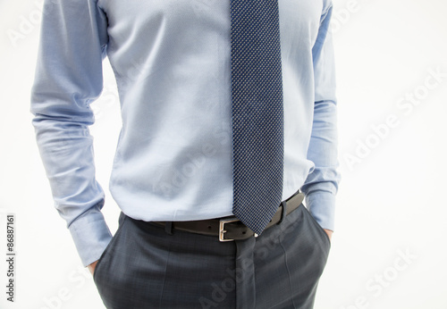 Unrecognizable businessman hiding his hands in pockets