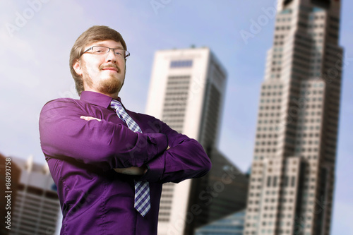 Wallpaper Mural Portrait of a young smiling businessman crossing his hands Torontodigital.ca