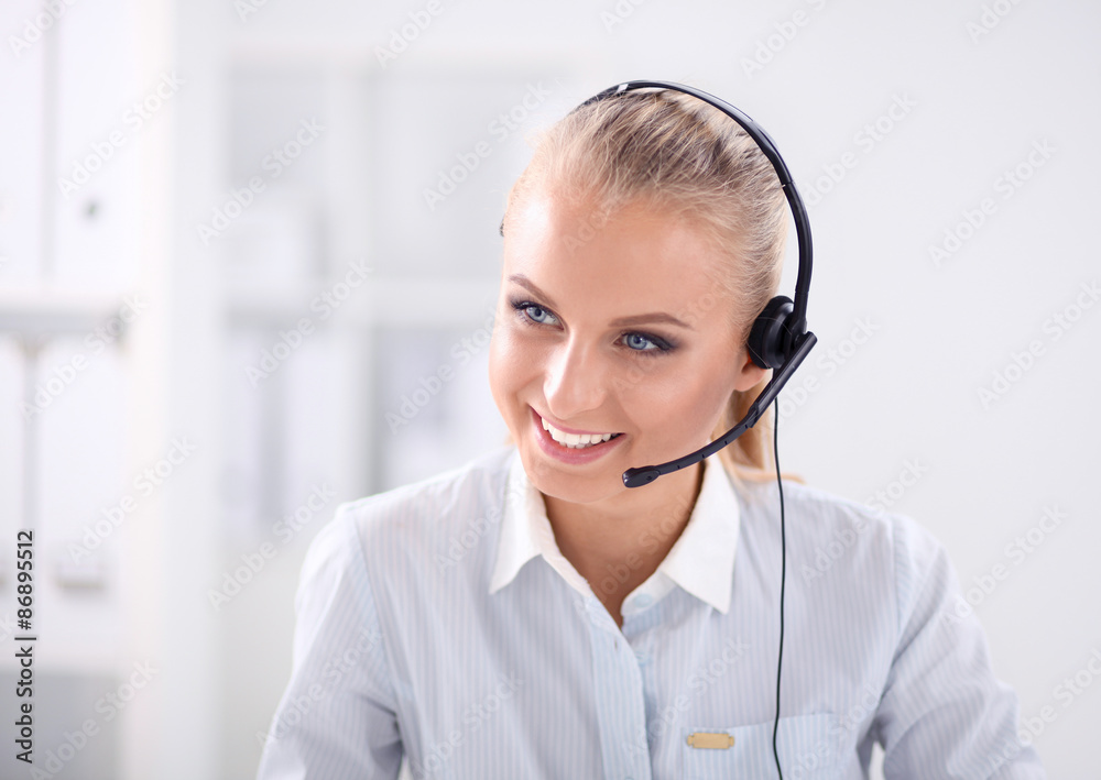 Close-up portrait of a customer service agent sitting at office Close-up portrait of a customer service agent sitting at office