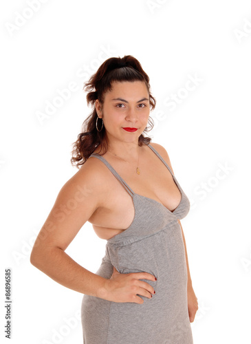 Young woman in gray dress halve length's.