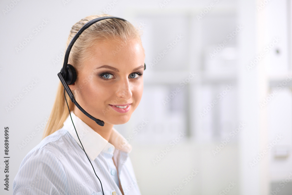 Close-up portrait of a customer service agent sitting at office Close-up portrait of a customer service agent sitting at office