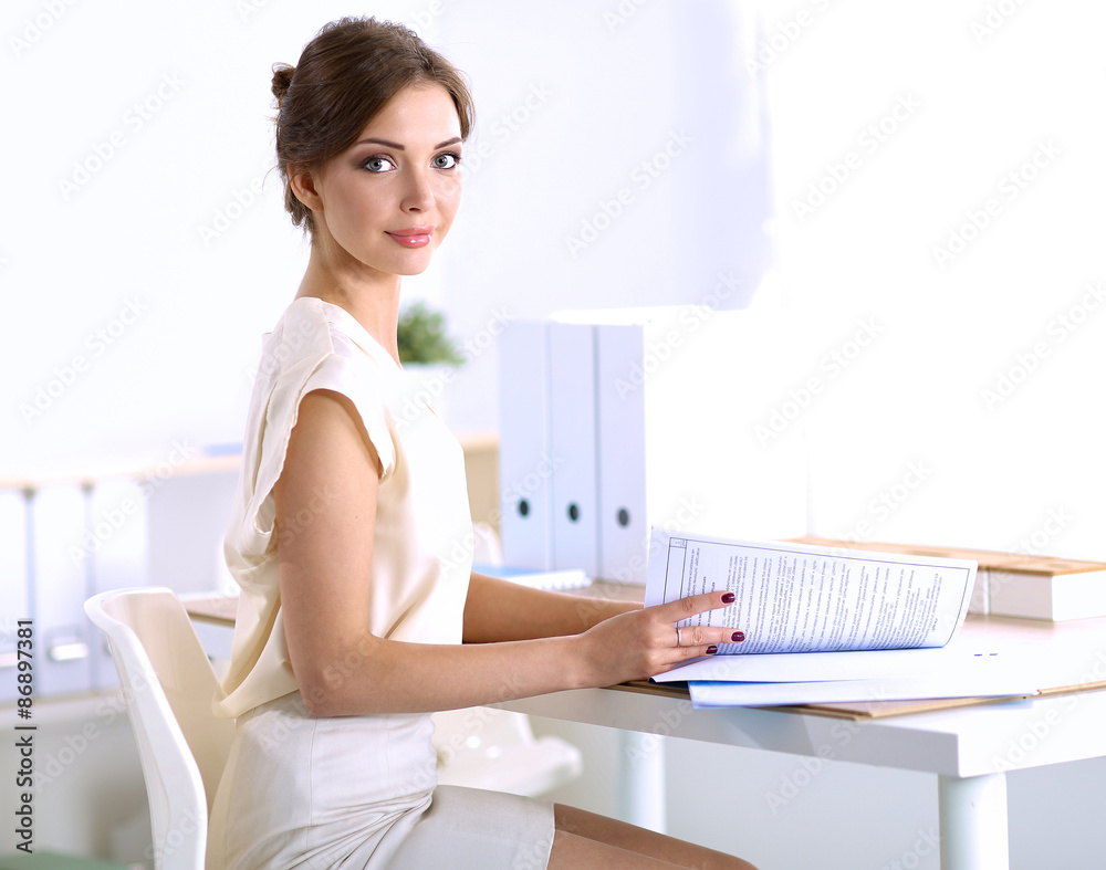 Obraz premium Portrait of a businesswoman sitting at desk with laptop