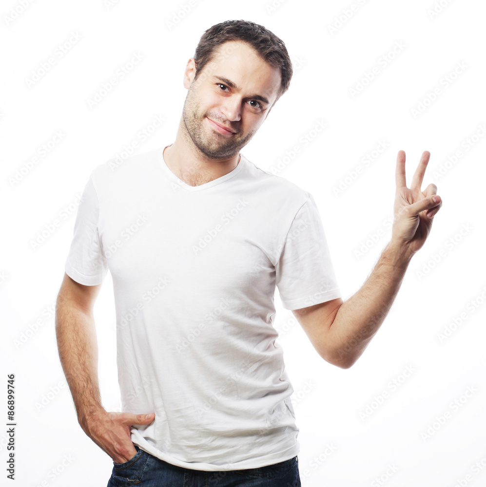 Happy handsome man showing thumbs up Happy handsome man showing thumbs up