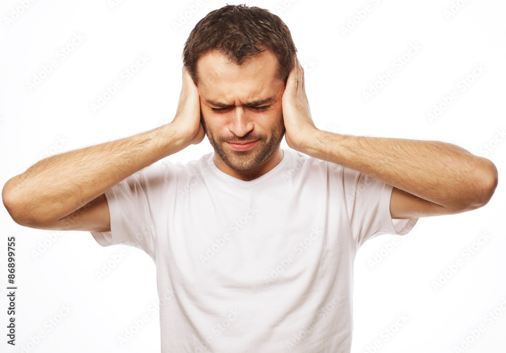man hold hands on temples ears man hold hands on temples ears