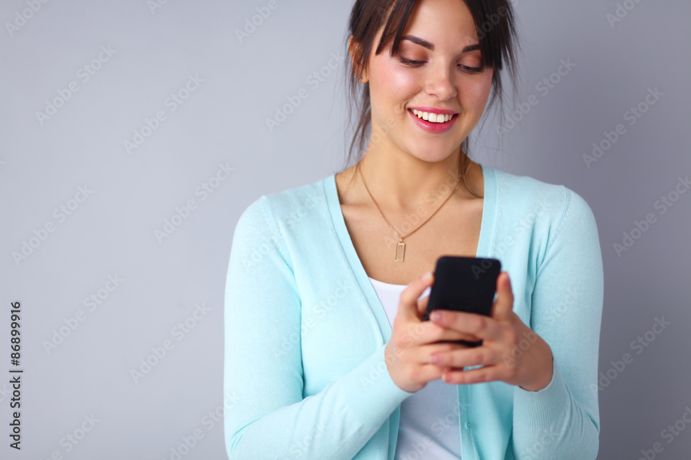 Woman using and reading a smart phone Woman using and reading a smart phone