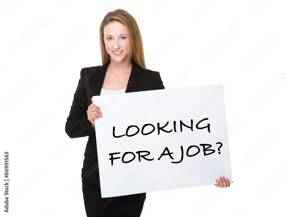 Businesswoman holding with a placard showing phrase of looking f Businesswoman holding with a placard showing phrase of looking f