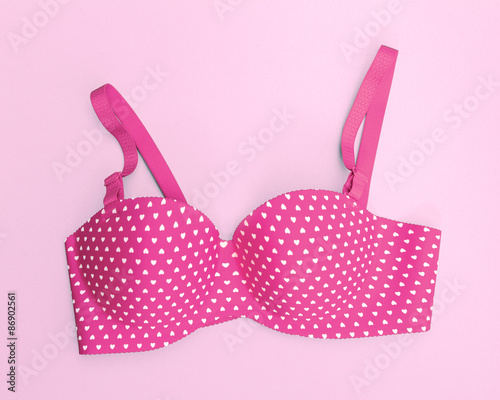 pink bra with many heart shapes on pink background