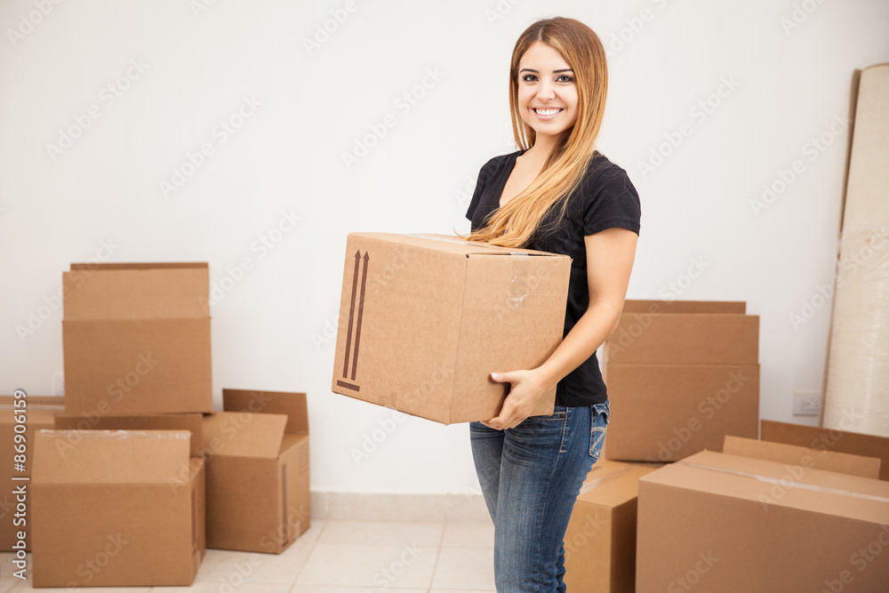 Cute girl carrying some boxes Cute girl carrying some boxes