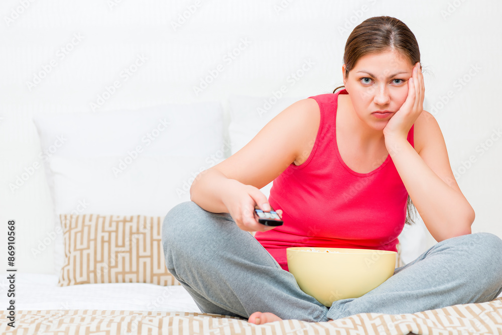 distressed female search an interesting show on TV distressed female search an interesting show on TV