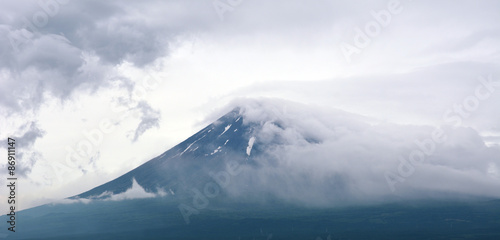 Fuji in stormy clouds