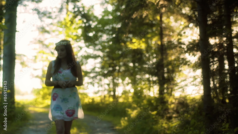 Girl walking in the forest alone and looking around
Girl walking in the forest alone and looking around