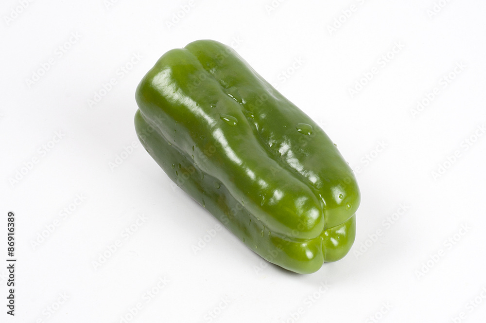 green fresh paprika on white background green fresh paprika on white background