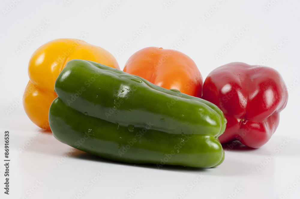 four fresh paprikas on white background four fresh paprikas on white background