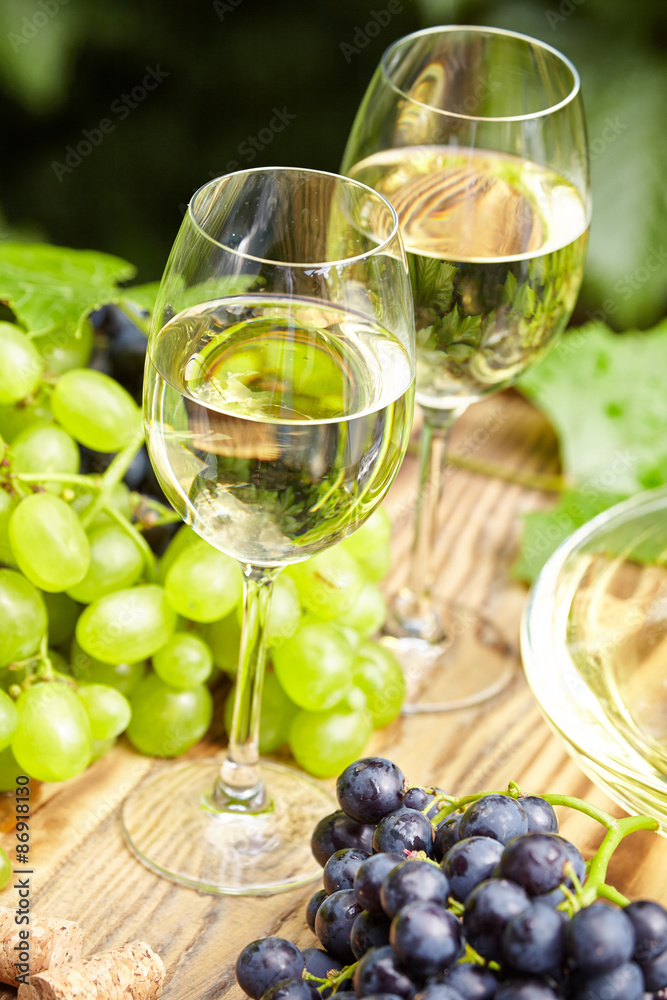 wine on wooden barrel on green garden terrace wine on wooden barrel on green garden terrace