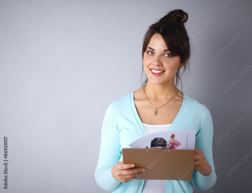 Woman with folder for documents on gray background Woman with folder for documents on gray background