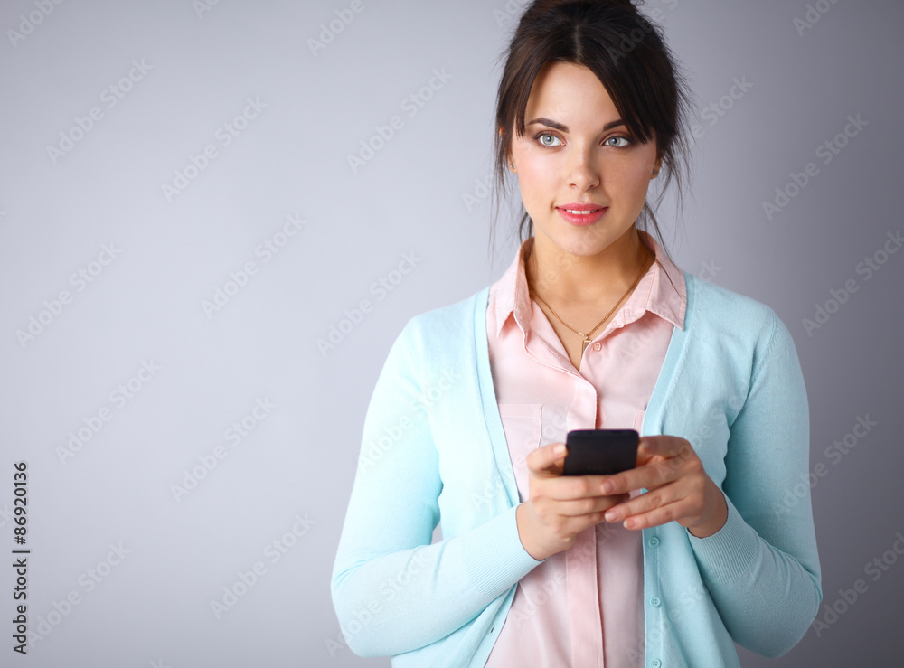 Woman using and reading a smart phone Woman using and reading a smart phone