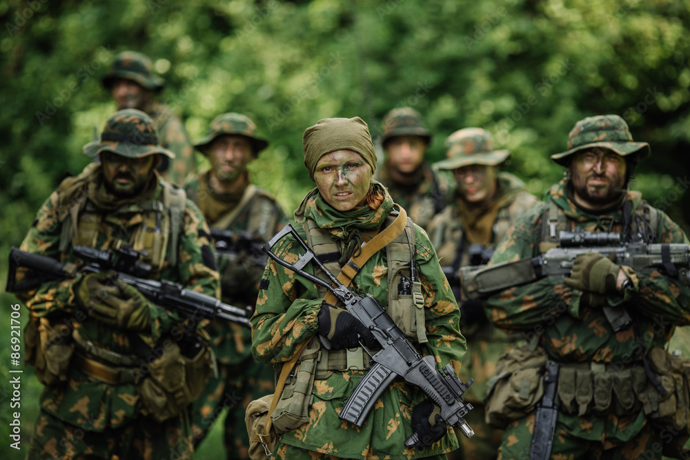 Group of soldiers special forces during the raid in the forest