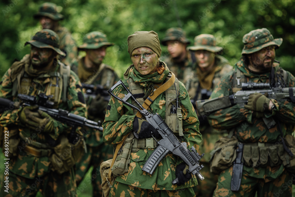 Group of soldiers special forces during the raid in the forest Group of soldiers special forces during the raid in the forest