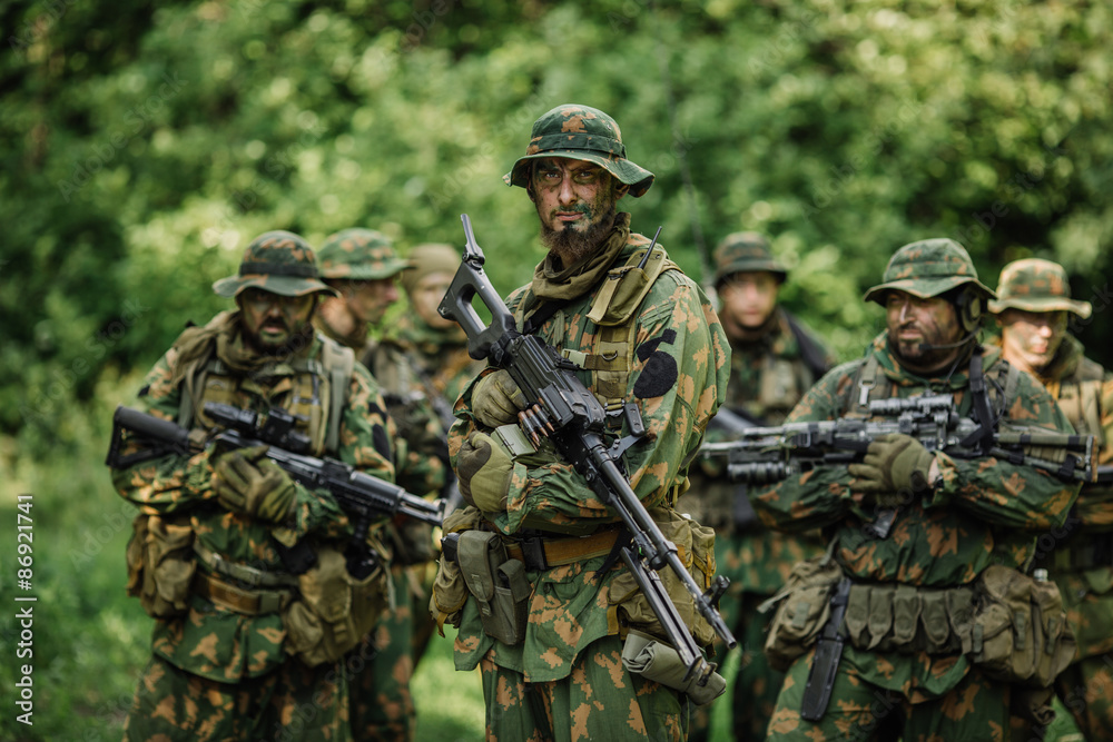 Group of soldiers special forces during the raid in the forest