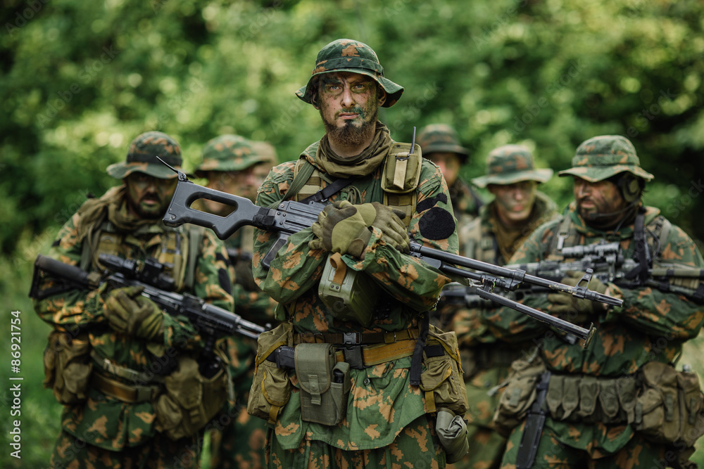 Group of soldiers special forces during the raid in the forest