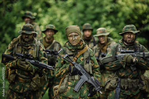 Group of soldiers special forces during the raid in the forest