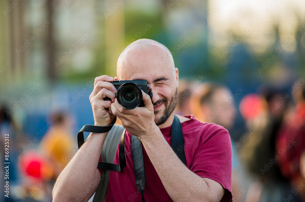 Portrait of a photographing photographer on the street. Portrait of a photographing photographer on the street.