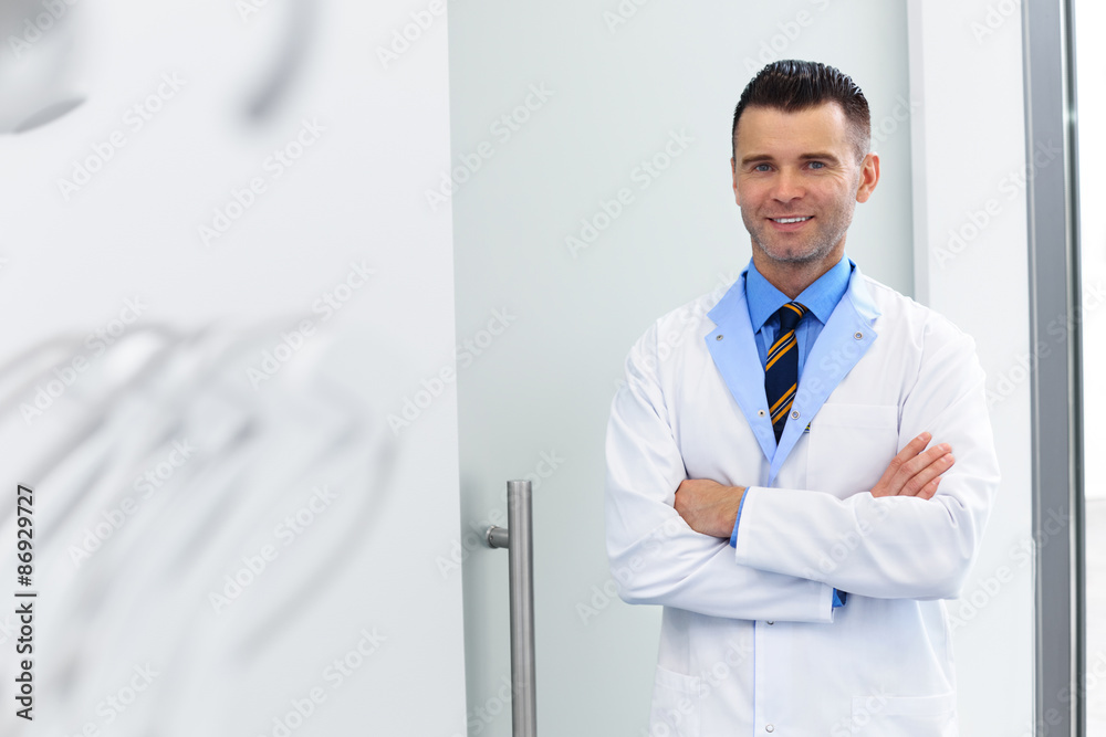 Dentist Portrait. Young Doctor at Dental Clinic. Teeth Care Dentist Portrait. Young Doctor at Dental Clinic. Teeth Care