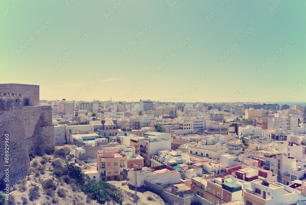 Panoramic view on the Andalusian city of Almeria from the top of Alcazaba fortress, on a sunny summer day. Image filtered in faded, washed out, retro style; nostalgic, vintage travel concept.