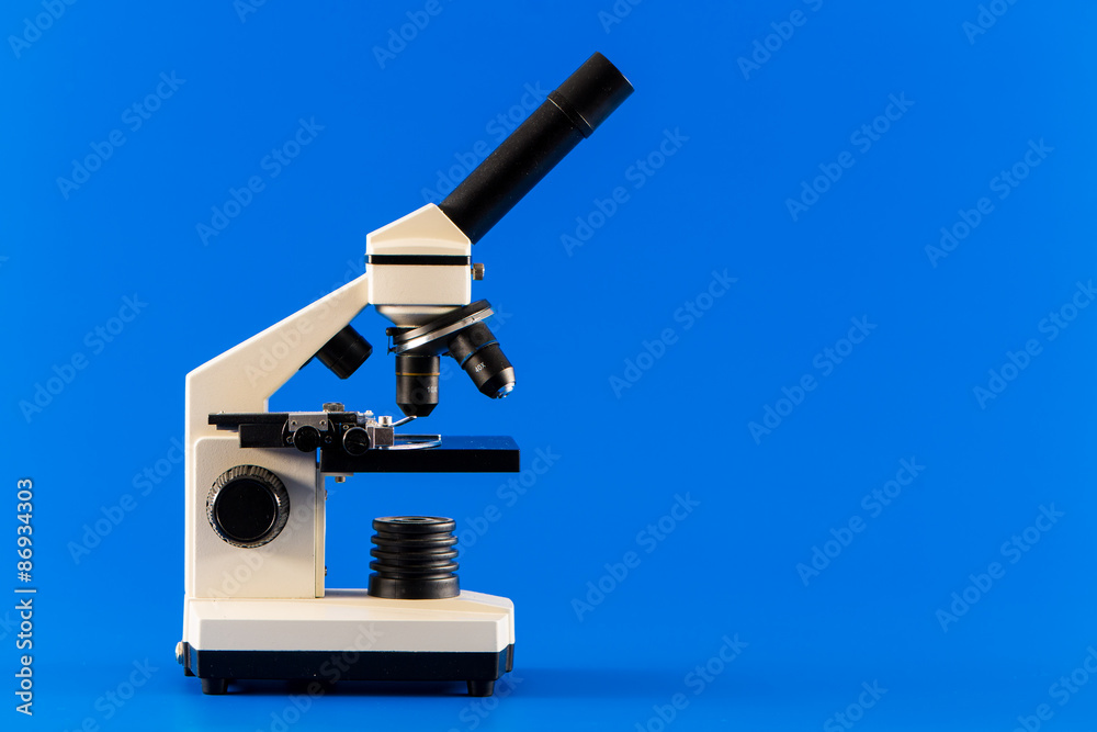 monocular microscope on blue background monocular microscope on blue background