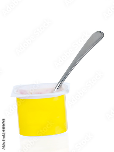 yoghurt yellow pot with spoon isolated on white background