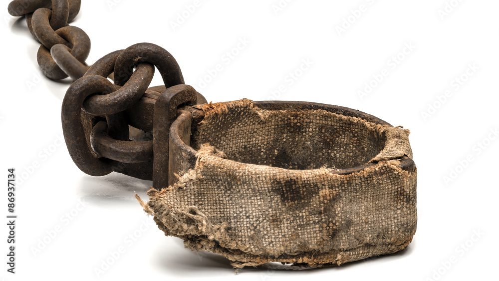 Rusty padded shackles used for locking up prisoners or slaves between 1600  and 1800. This might be a leg cuff or a neck cuff Stock Photo