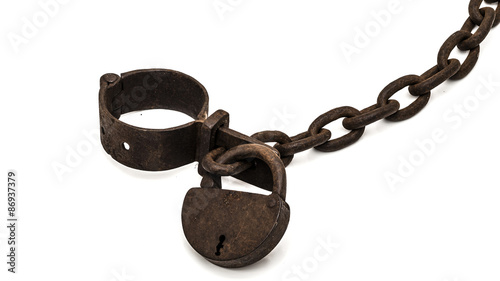 Rusty old shackles with padlock used for locking up prisoners or slaves between 1600 and 1800.