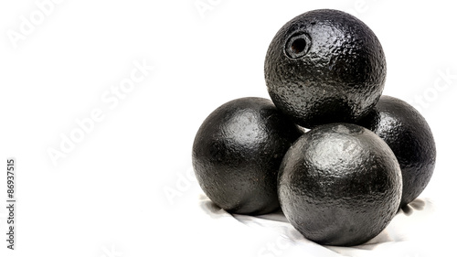 20 pound round grenades showing the hole where the gunpowder would be filled in and the fuse would be placed. with the fuse this would look exactly like the classic cartoon bomb,