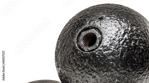 20 pound round grenades showing the hole where the gunpowder would be filled in and the fuse would be placed. with the fuse this would look exactly like the classic cartoon bomb,