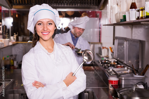 Chef and his helper at bistro kitchen