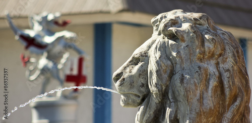 Photography A Lion Statue Shoots an Arc of Water