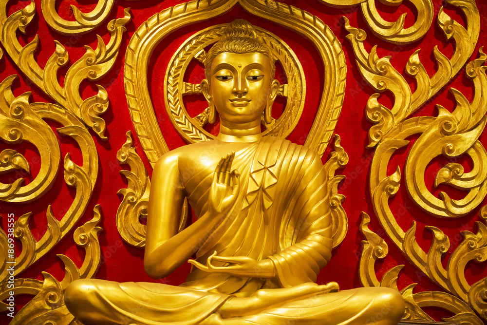 Golden Buddha sits in the temple