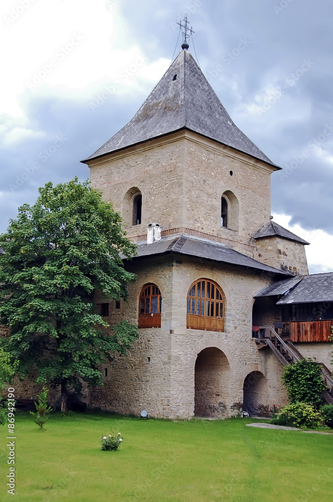 Interior garden of an old monastery in Romanian Moldavian Mountains