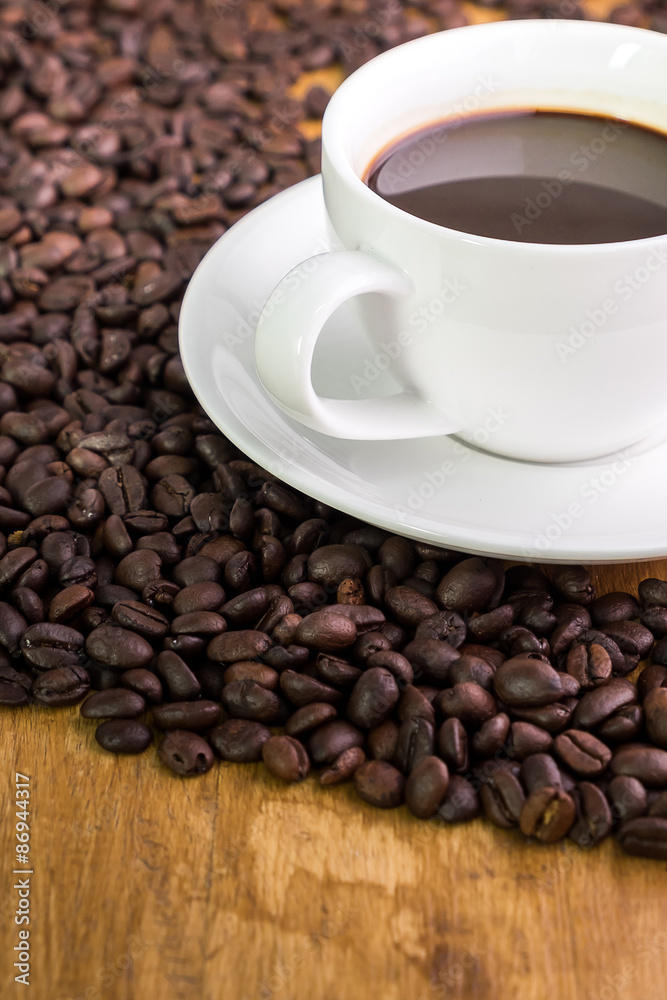 Fototapeta premium Coffee cup on a wooden table