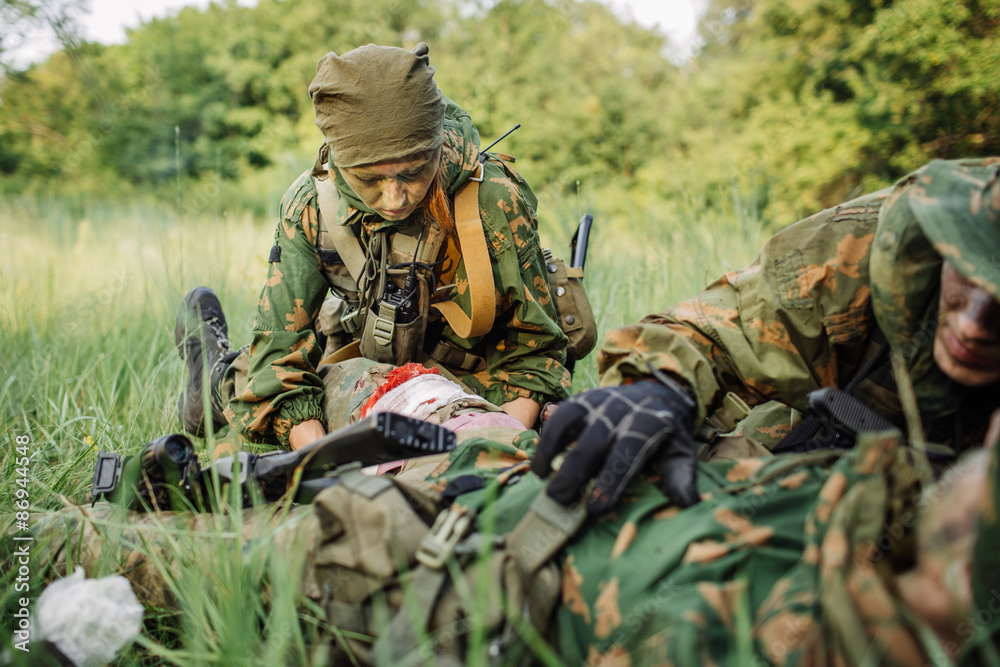 a military doctor to help the wounded soldier a military doctor to help the wounded soldier