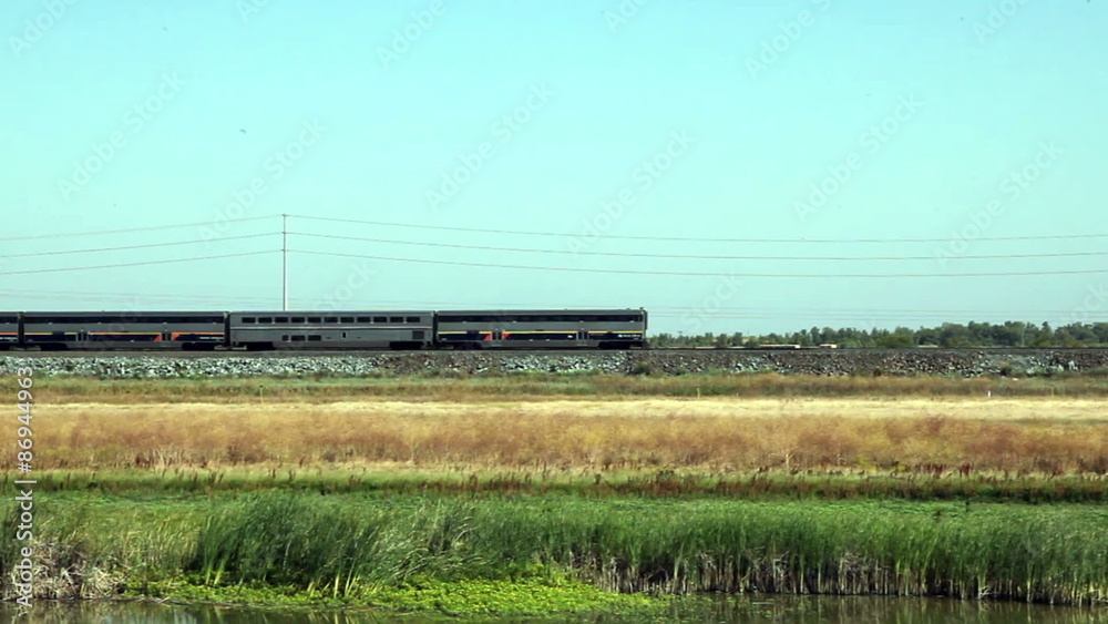 Passenger Train Moving Backwards With Engine And Four cars Passenger Train Moving Backwards With Engine And Four cars