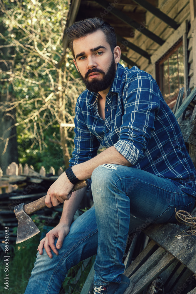 Handsome bearded man with axe Handsome bearded man with axe