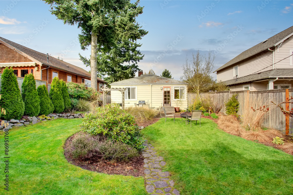 Authentic back yard with patio and greenery. Authentic back yard with patio and greenery.