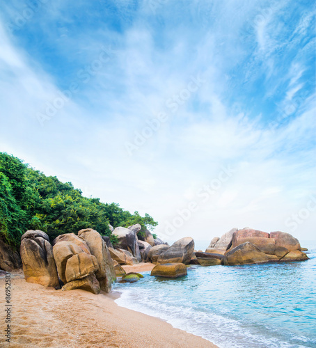 Exotic palm forest, beach, rocks and sea. Samui, Thailand.