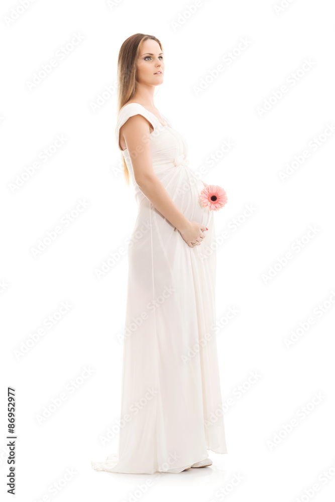 Young and beautiful pregnant woman in antique dress over grey background with a lot of blank space Young and beautiful pregnant woman in antique dress over grey background with a lot of blank space