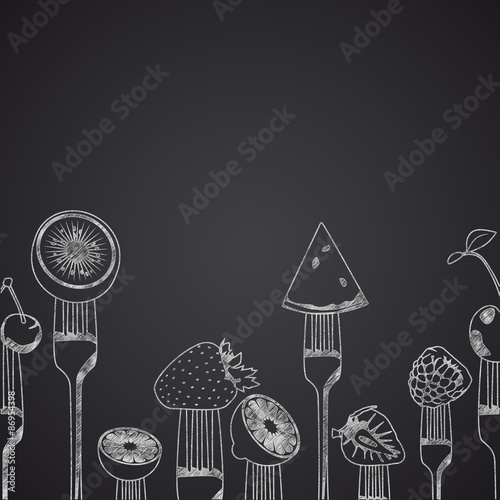 Fruits on forks drawn on chalkboard