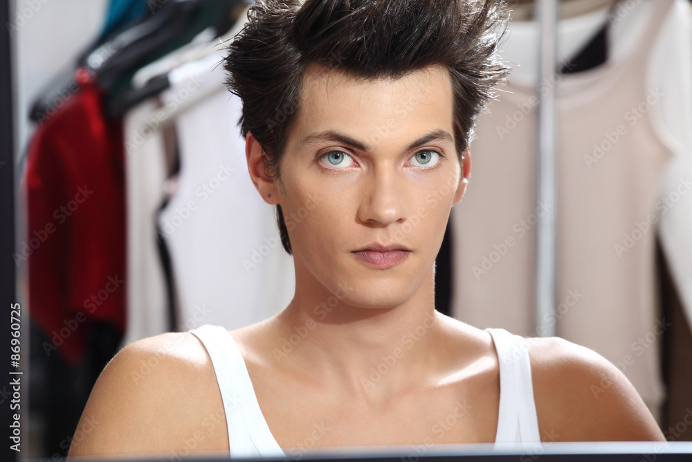 portrait of handsome model at mirror in dressing room portrait of handsome model at mirror in dressing room